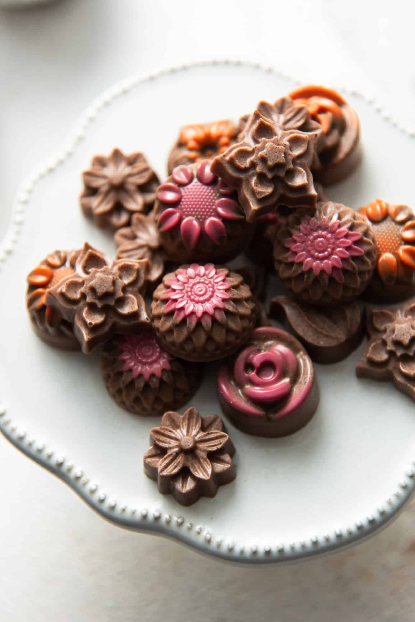 A plate of my favorite recipe for vegan keto sugar free fat bombs made with protein powder