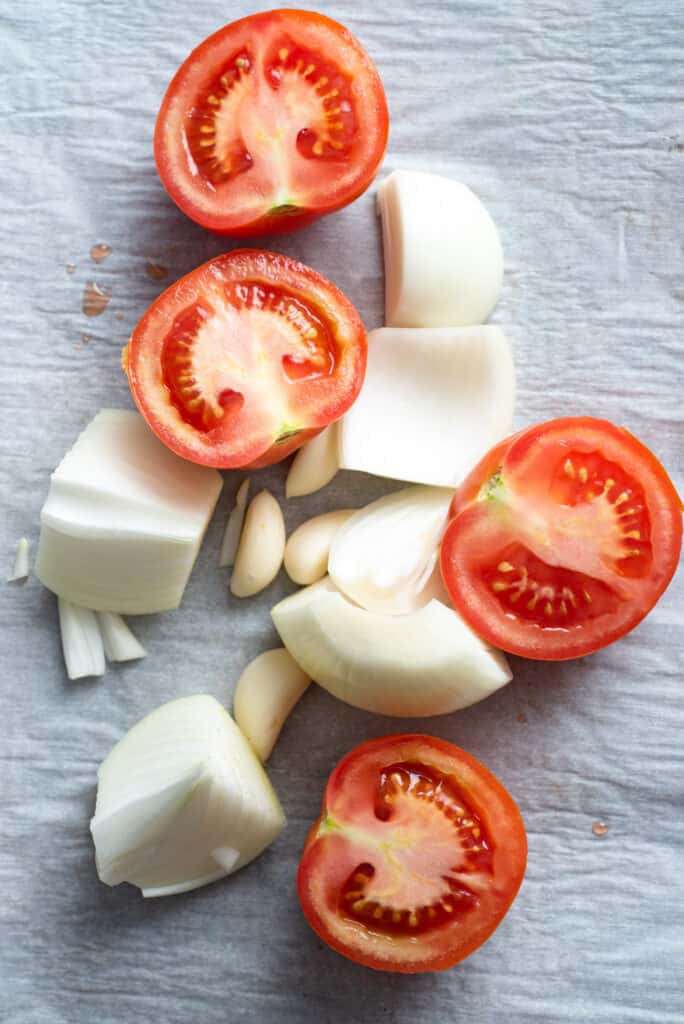 Ingredients for Mexican style rice include tomatoes, garlic and onions
