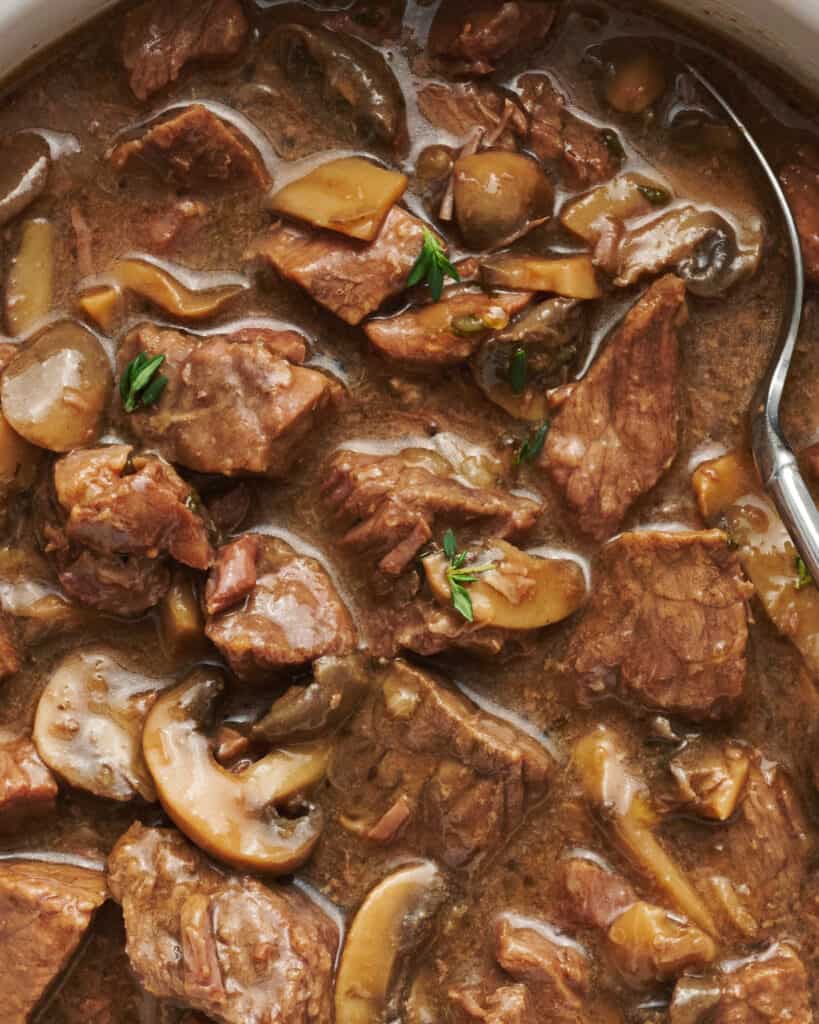 close up view of beef tips in sherry gravy