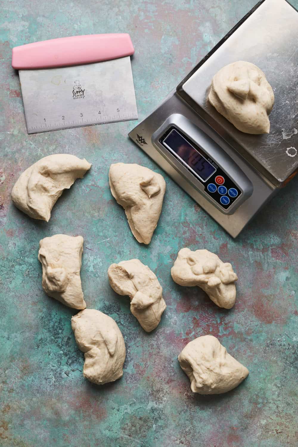 pieces of dough portioned out based on being weighed on a scale