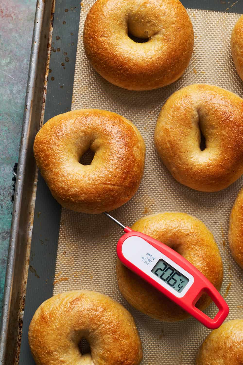 taking the temp of a bagel with an instant read probe thermometer