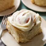 single cinnamon roll on a plate