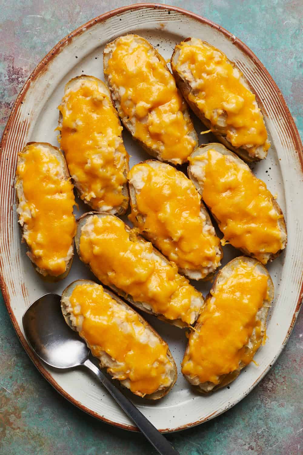 A platter filled with Tuna Baked Potatoes