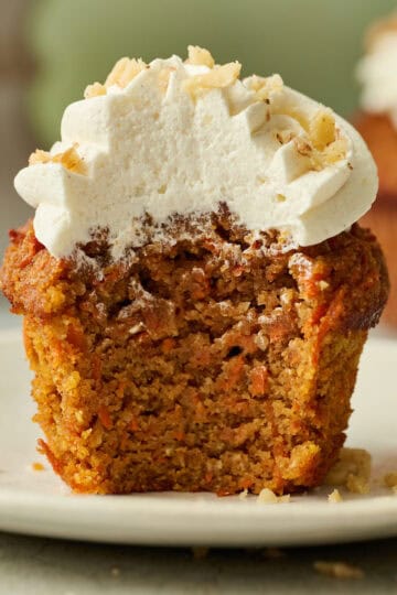 carrot cake cupcake with a bite taken out