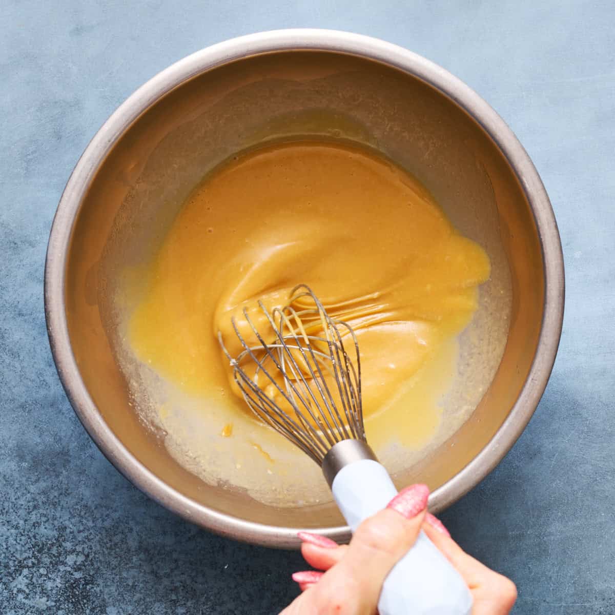 whisking the wet ingredients in a bowl