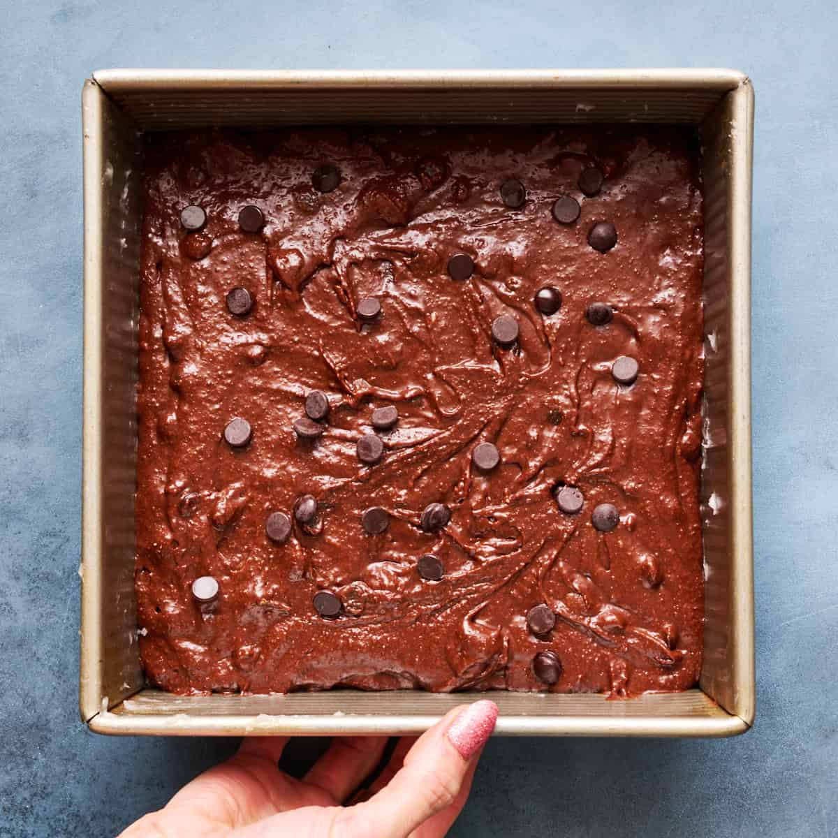 brownie batter sprinkled with chocolate chips ready to be baked