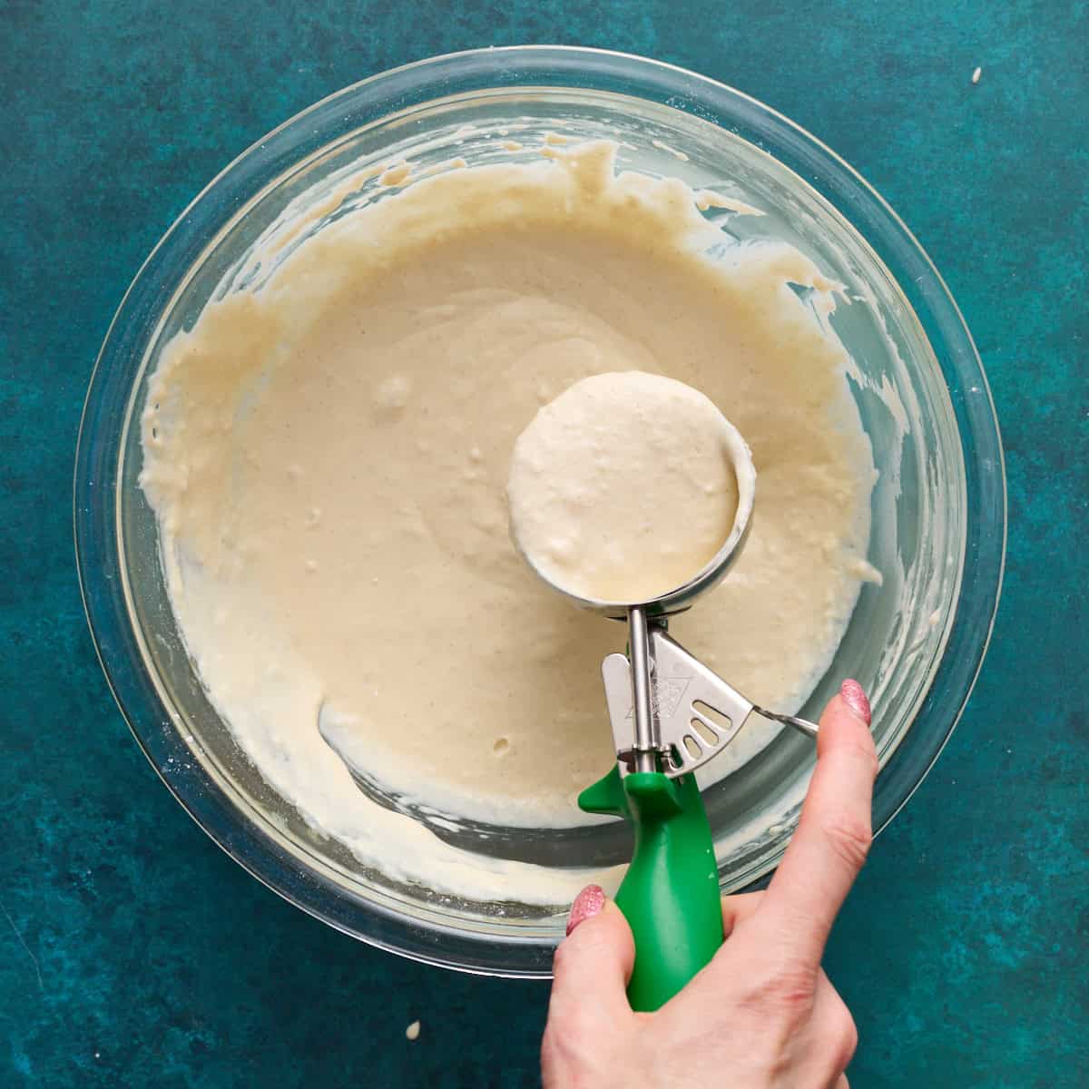 scooping waffle batter