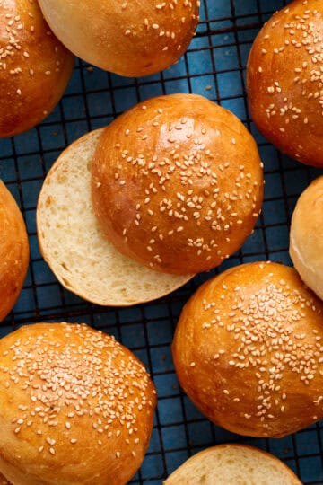 overhead of hamburger buns on a cooling rack