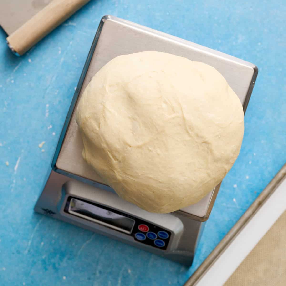 weighing the dough on a kitchen scale