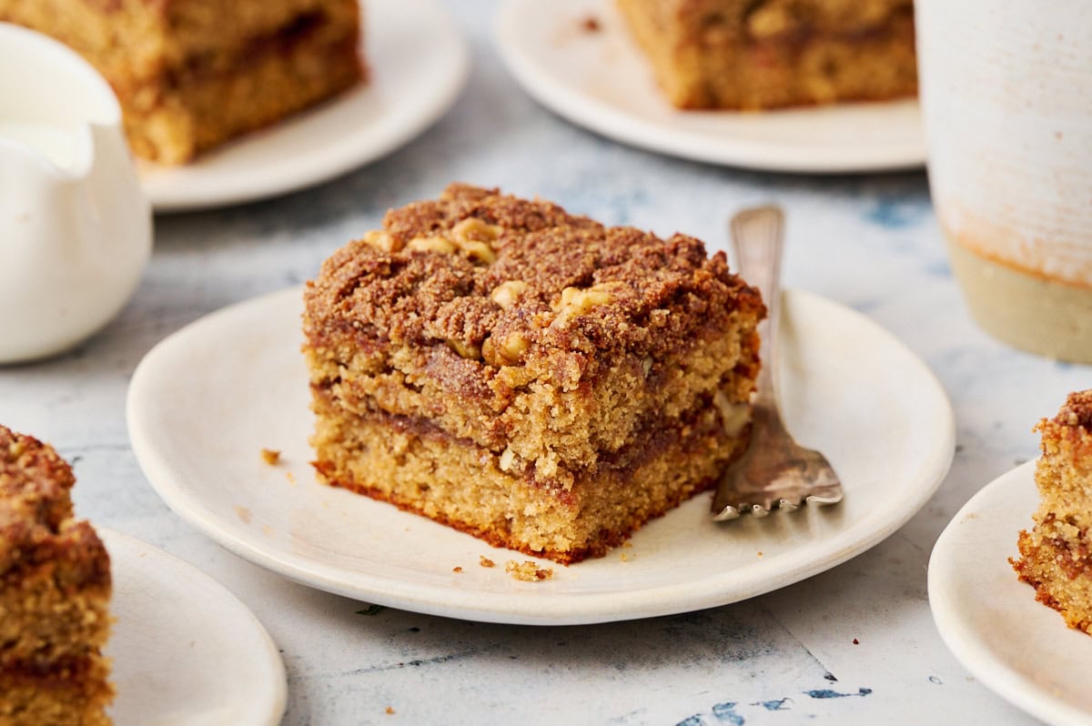 a slice of coffee cake on a plate with a fork