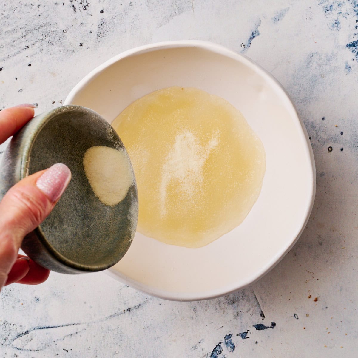 sprinkling gelatin on water