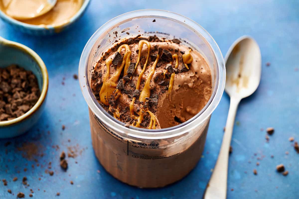 a container of protein ice cream with a spoon