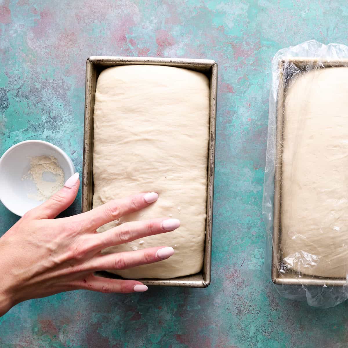 testing the dough for doneness by poking it with a floured finger