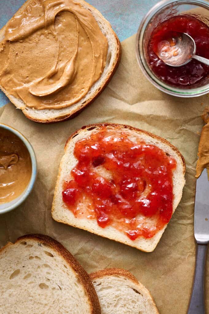sourdough sandwich bread being made into peanut butter and jelly