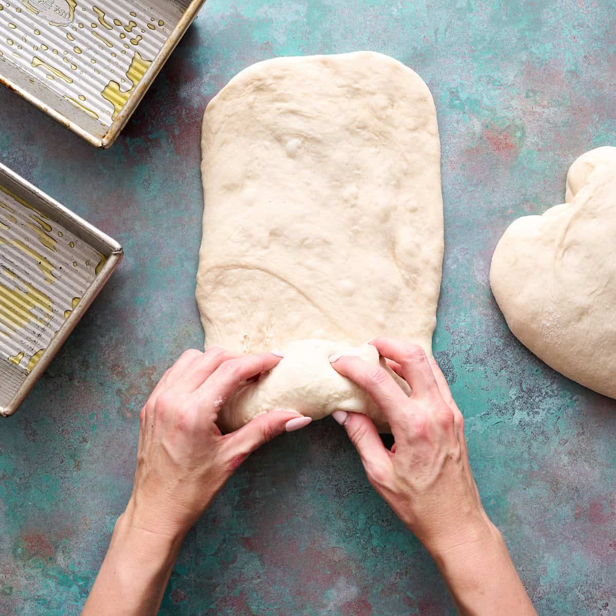 rolling up the dough to form the loaf