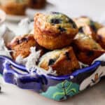 Cottage Cheese Blueberry Muffins stacked in a blue serving dish