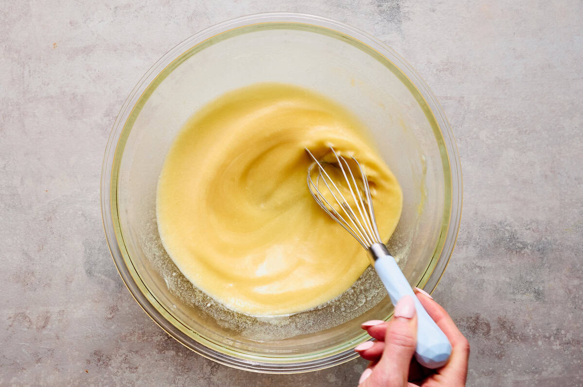 whisking the eggs with the other wet ingredients