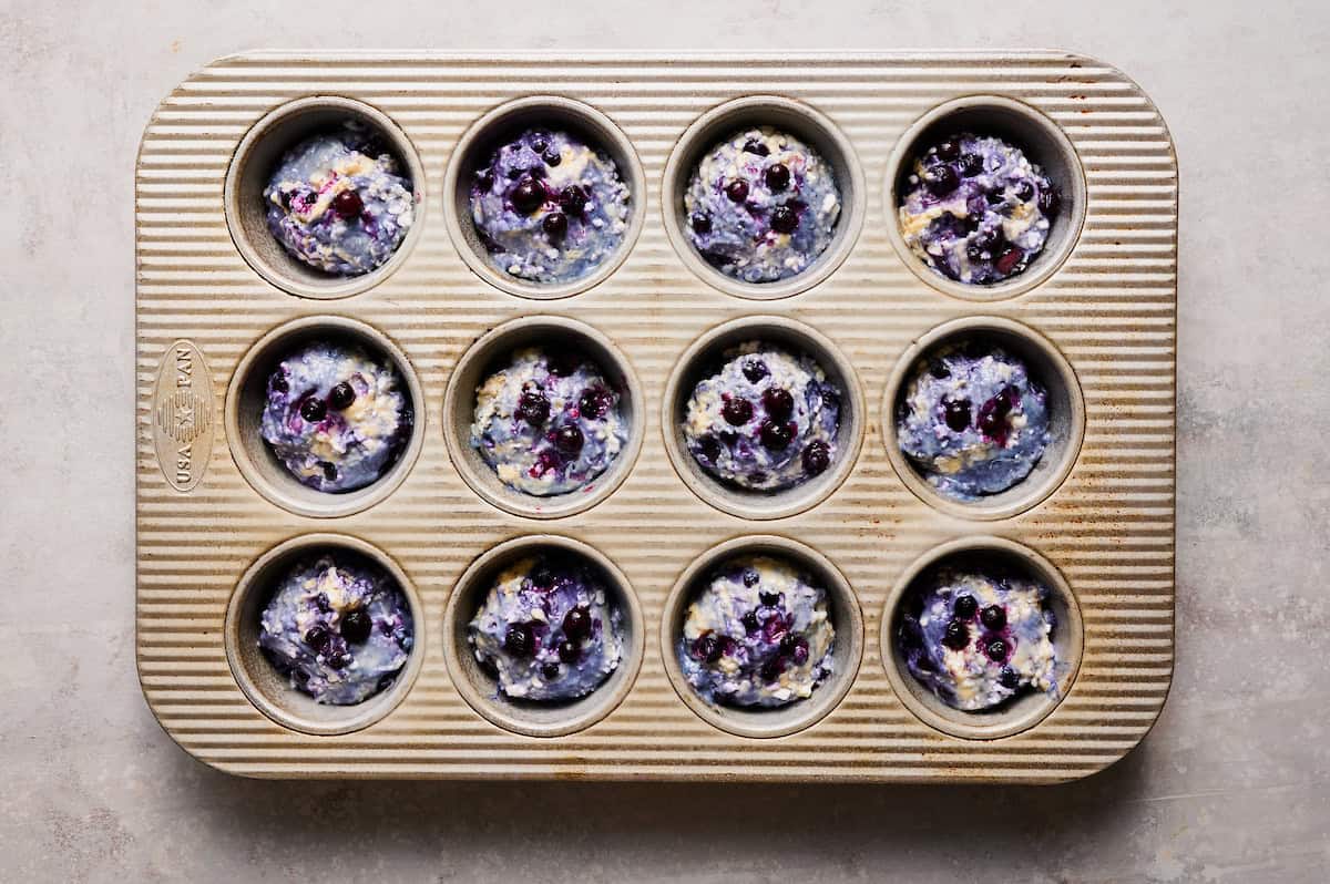 blueberry muffin batter in a baking pan