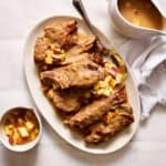 Slow Cooker Country Style Pork Ribs with Apple Gravy on a serving platter