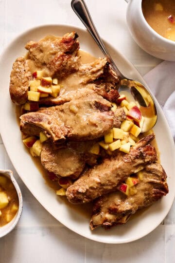 Slow Cooker Country Style Pork Ribs with Apple Gravy on a serving platter