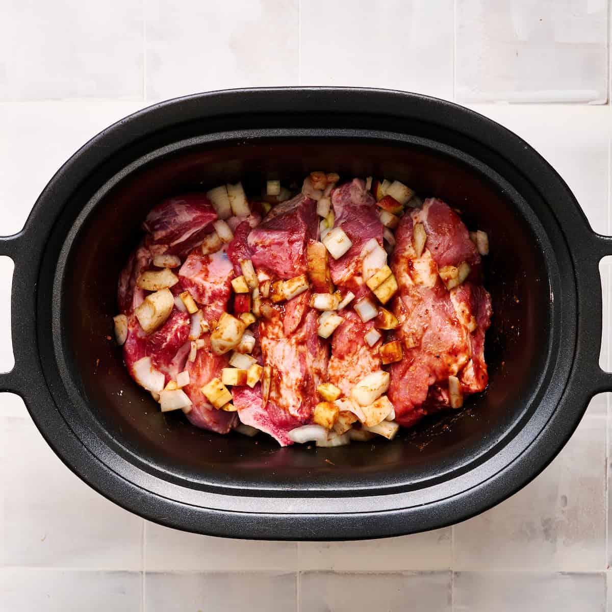 all the ingredients in the slow cooker before cooking