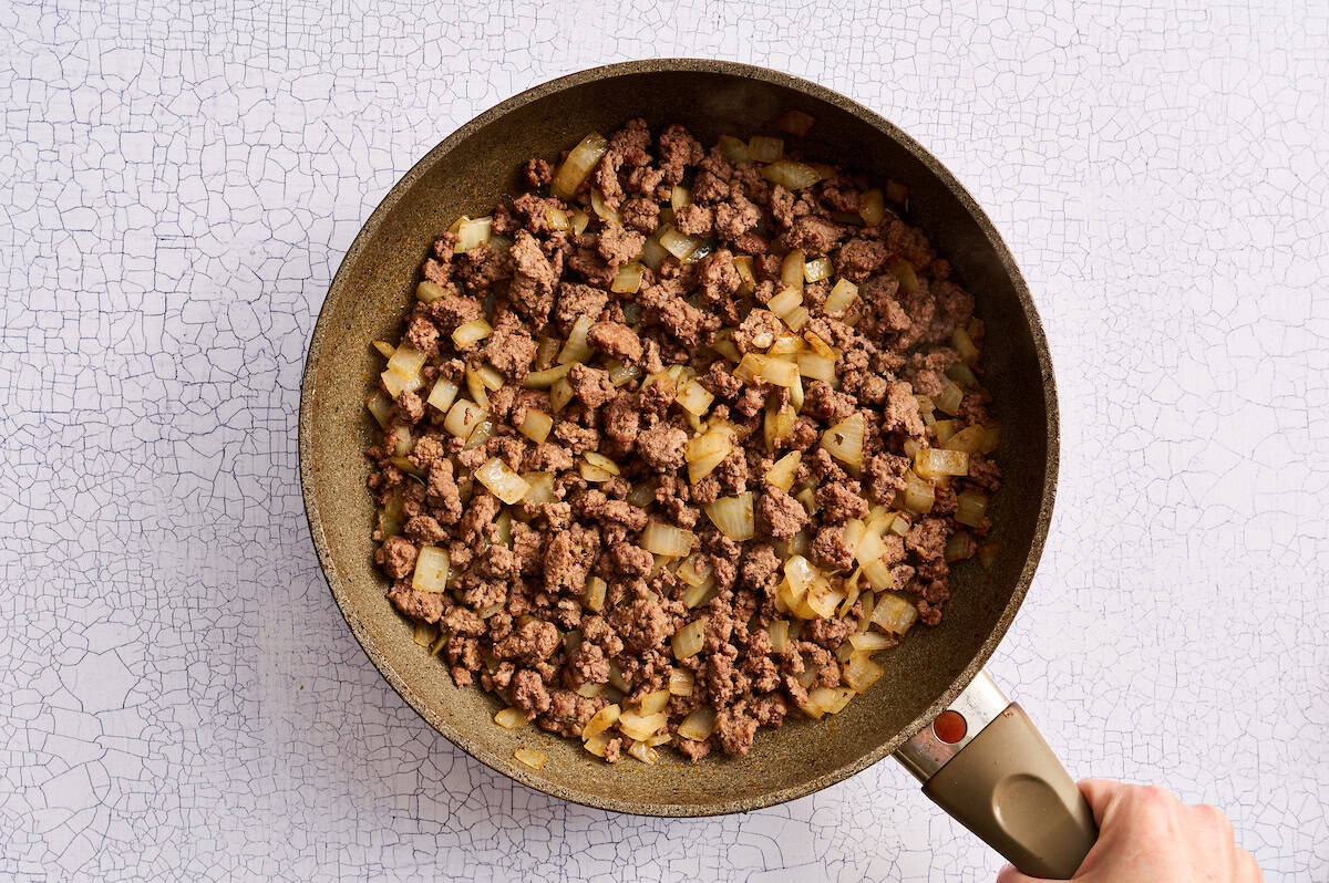 ground beef and onion seasoned in a skillet
