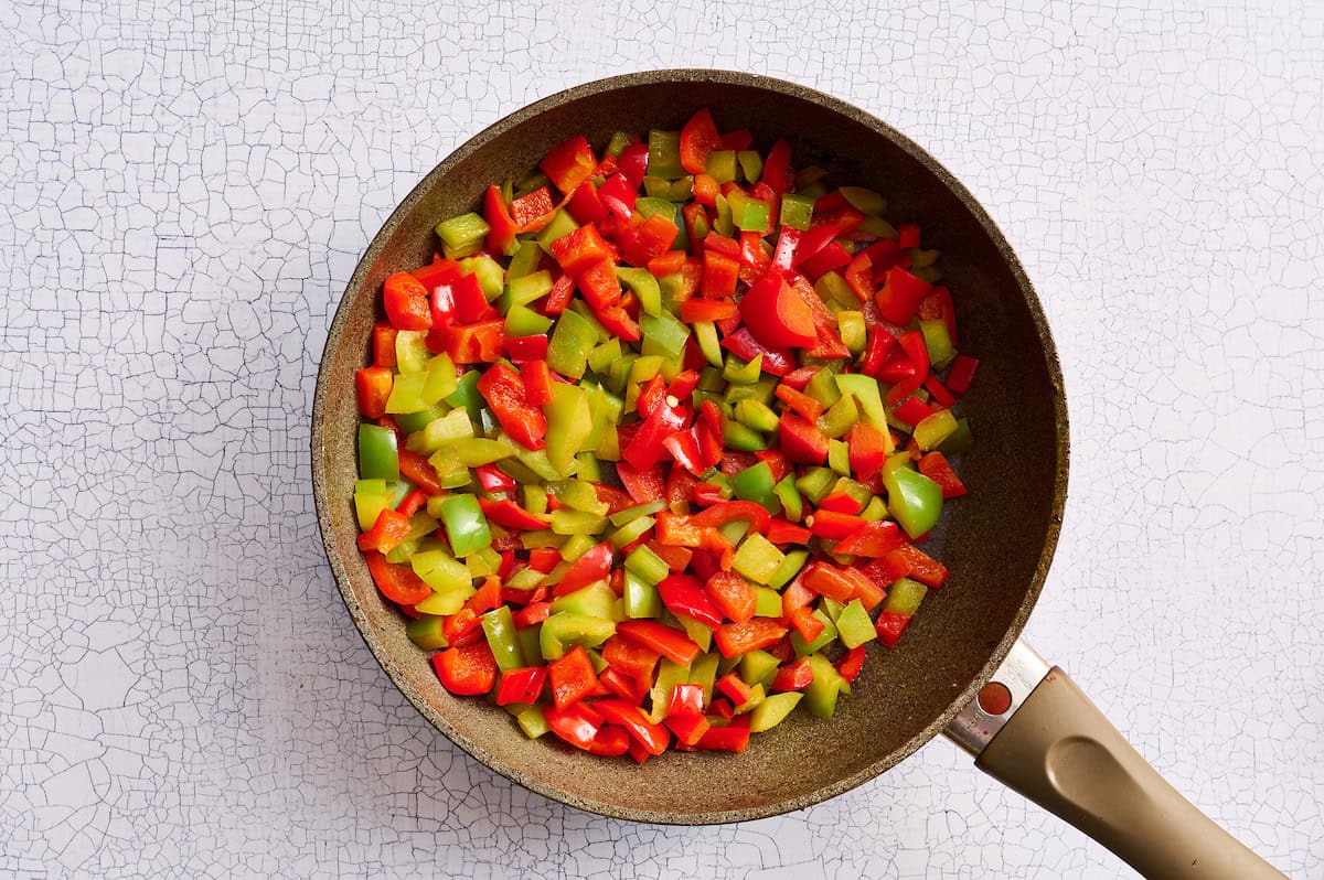 red and green peppers in a skillet