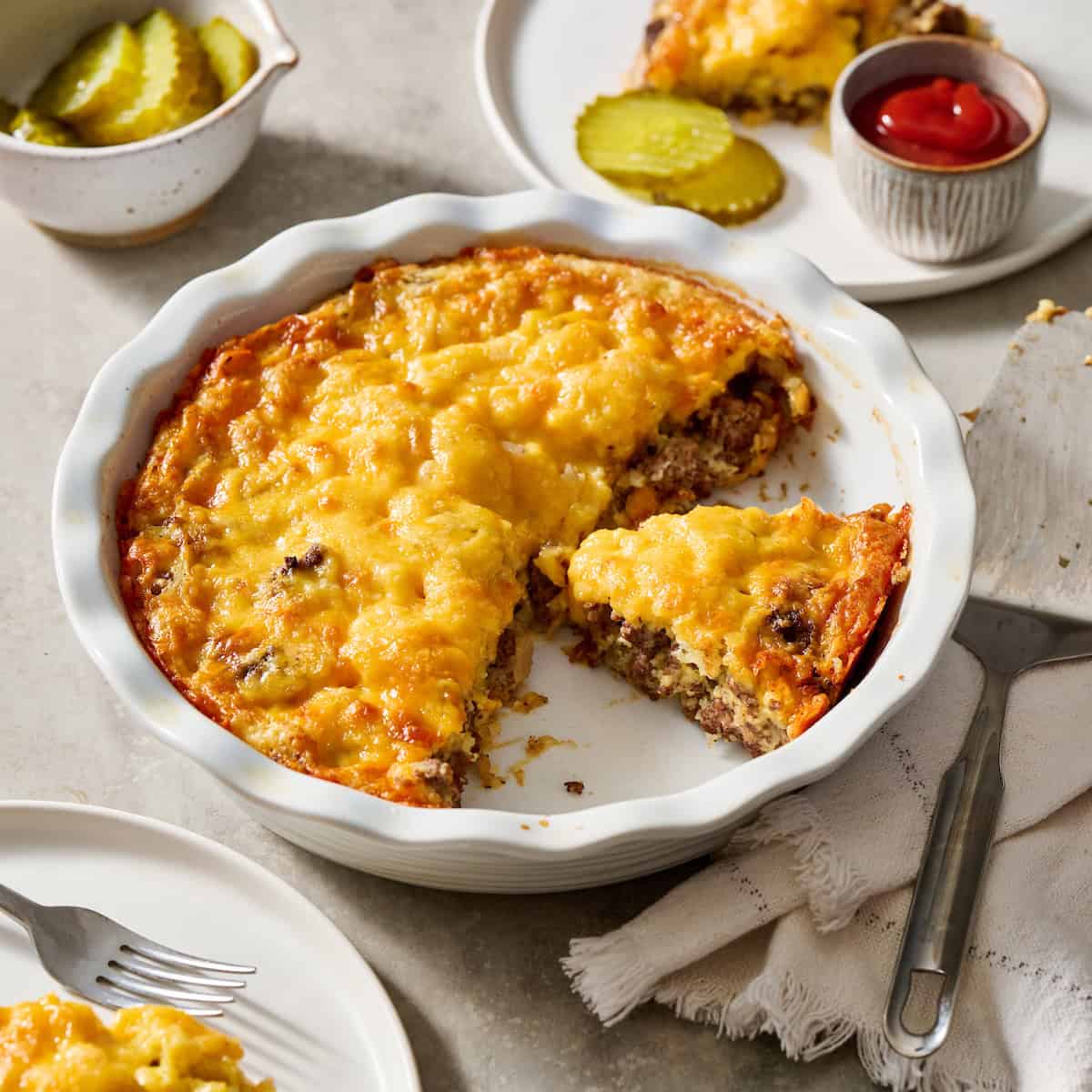 Cheeseburger Pie being served on white plates