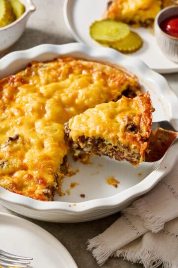 Cheeseburger Pie being served on white plates