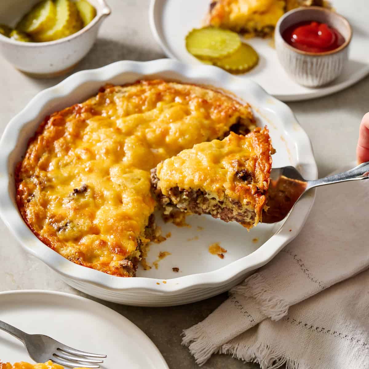 Cheeseburger Pie being served on white plates