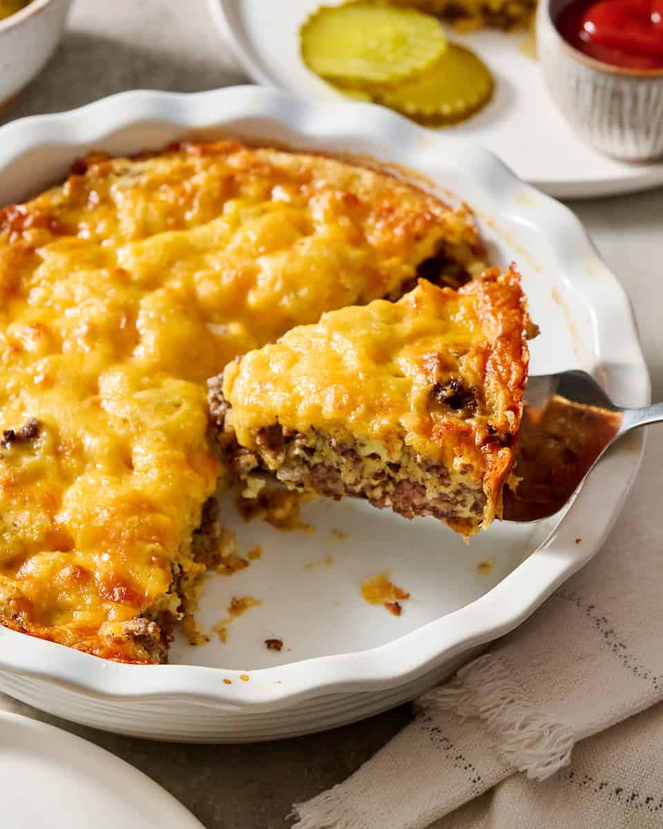 Cheeseburger Pie being served on white plates
