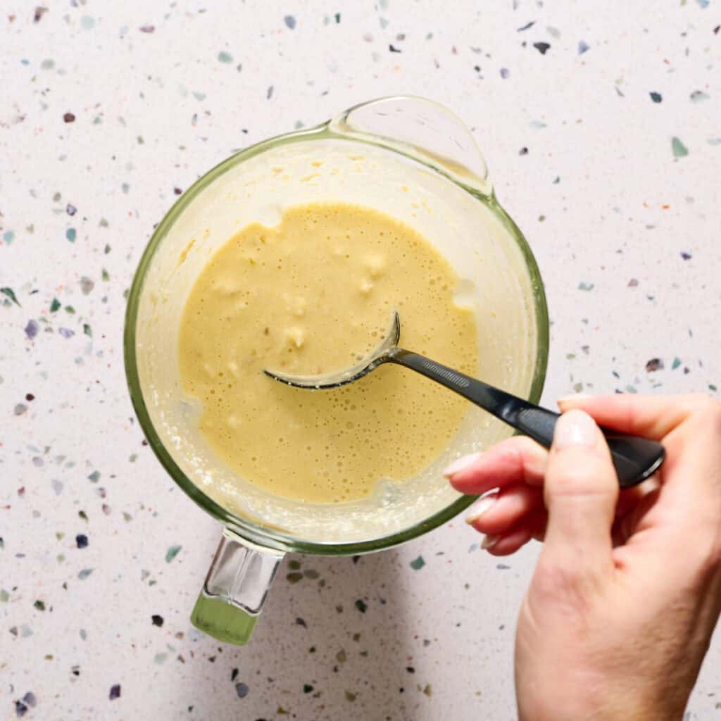 Muffin tin filled with egg and cheese mixture