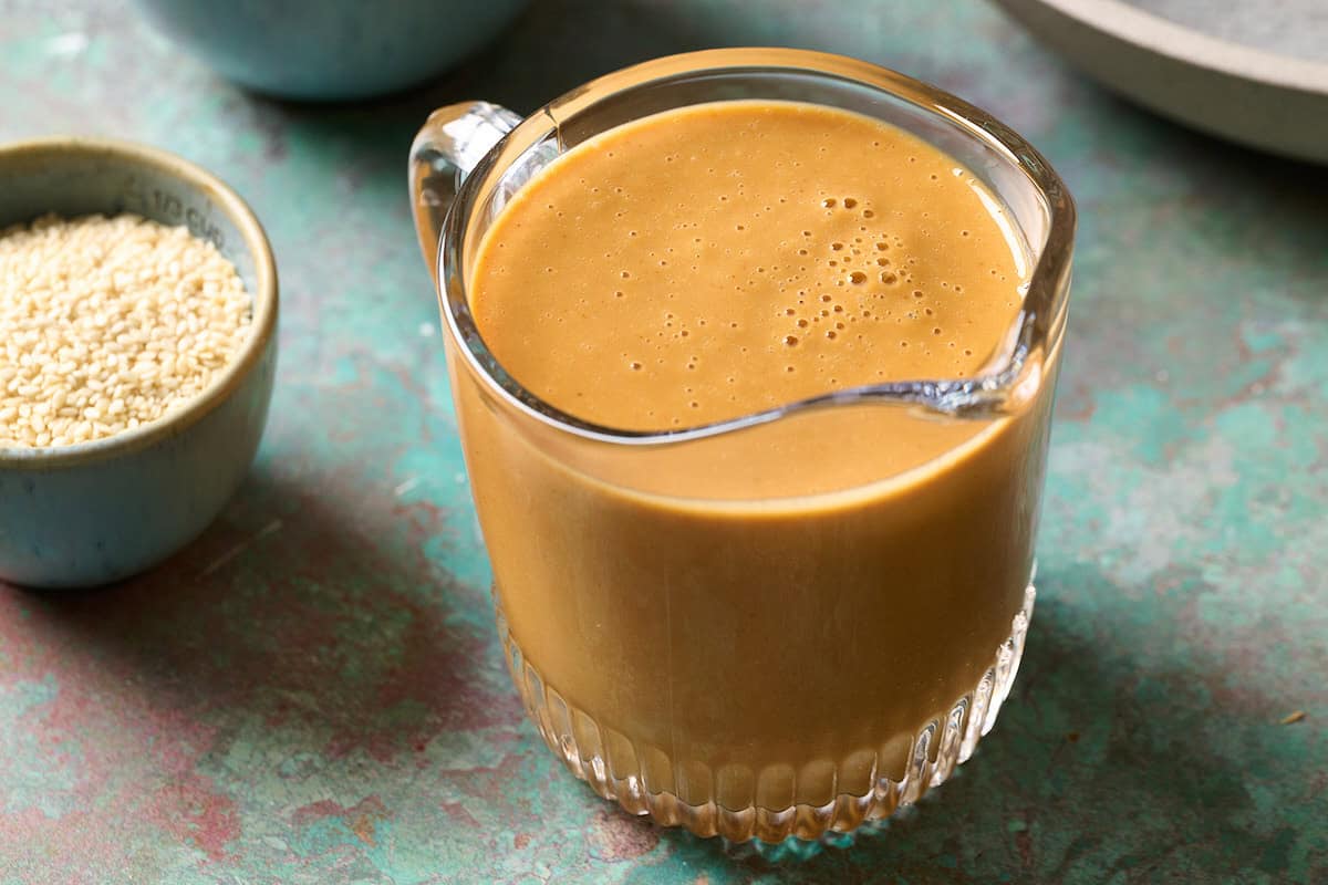 Peanut sauce in a large glass cup