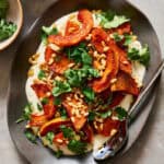 plated roasted squash with whipped ricotta and cilantro and pine nuts on the side