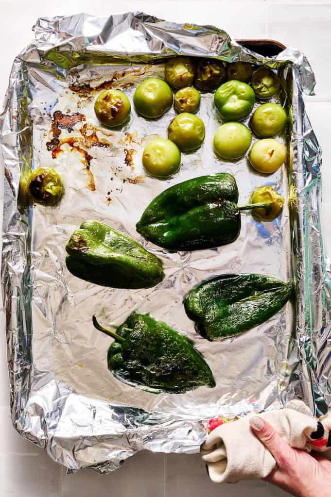 poblanos and tomatillos after roasting in the oven
