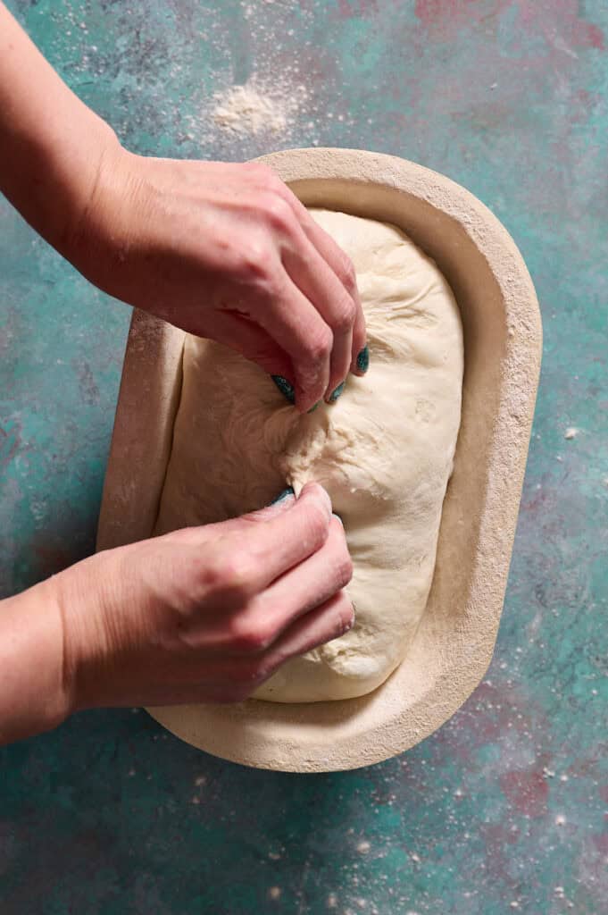 closing the seam on the bottom of the loaf before proofing