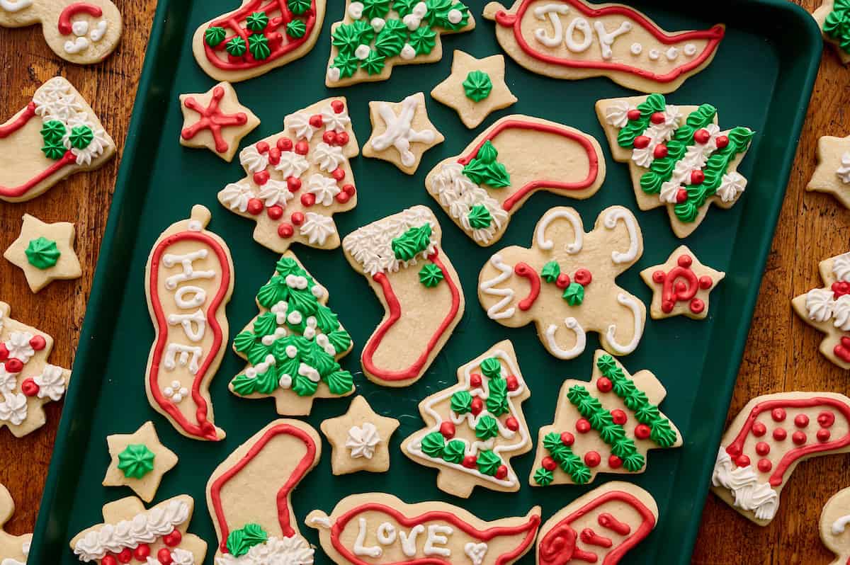 sugar cookies decorated with royal icing on a sheet pan