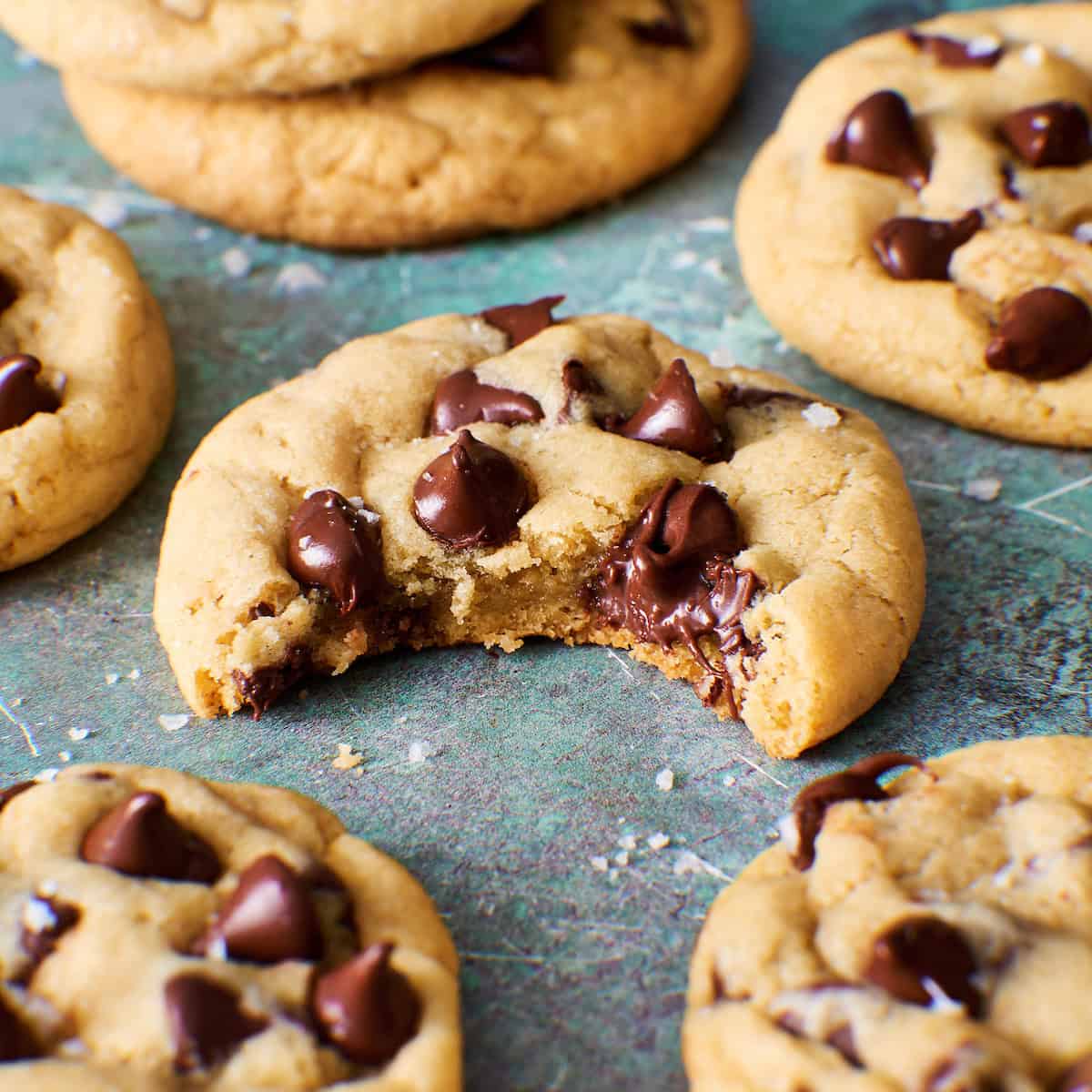 sourdough discard cookie with a bite taken out to show gooey chocolate and soft interior