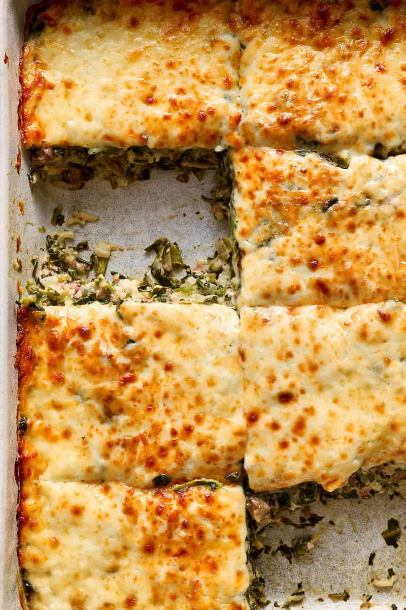 closeup of the beef and spinach casserole with a slice taken out