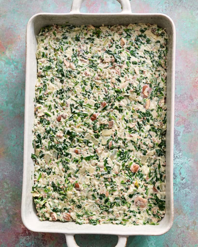 creamy spinach mixture smoothed into a 9 x 13 casserole dish
