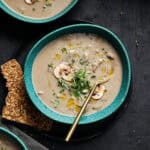 bowl of dairy free cream of mushroom soup in a green bowl
