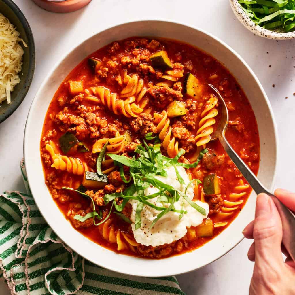 spooning lasagna soup