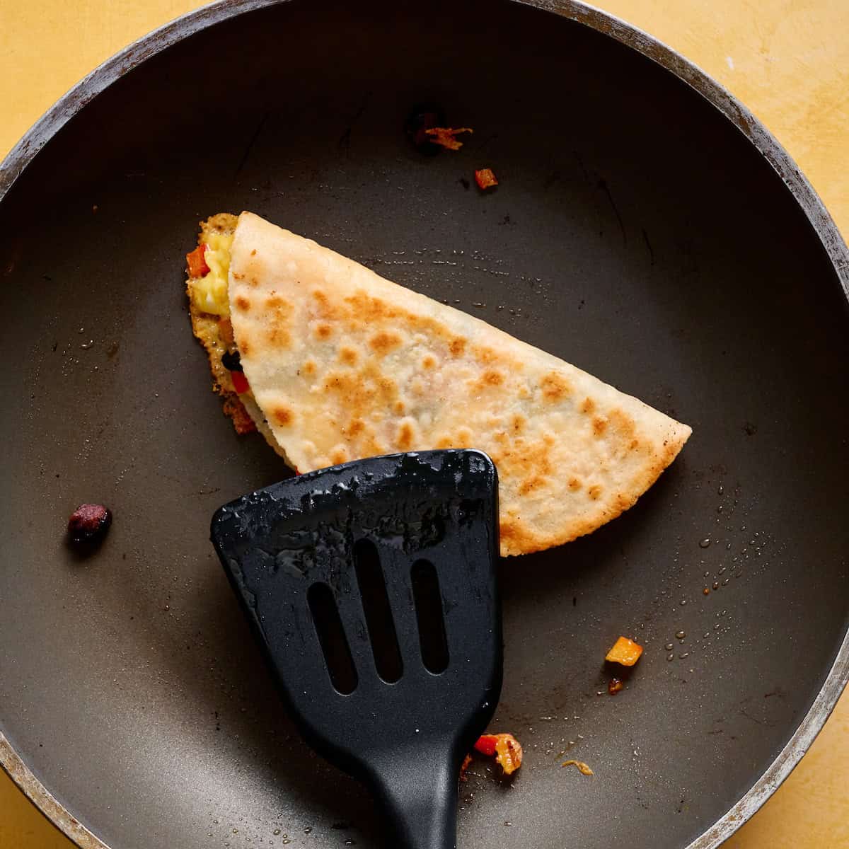 folding the quesadilla in half