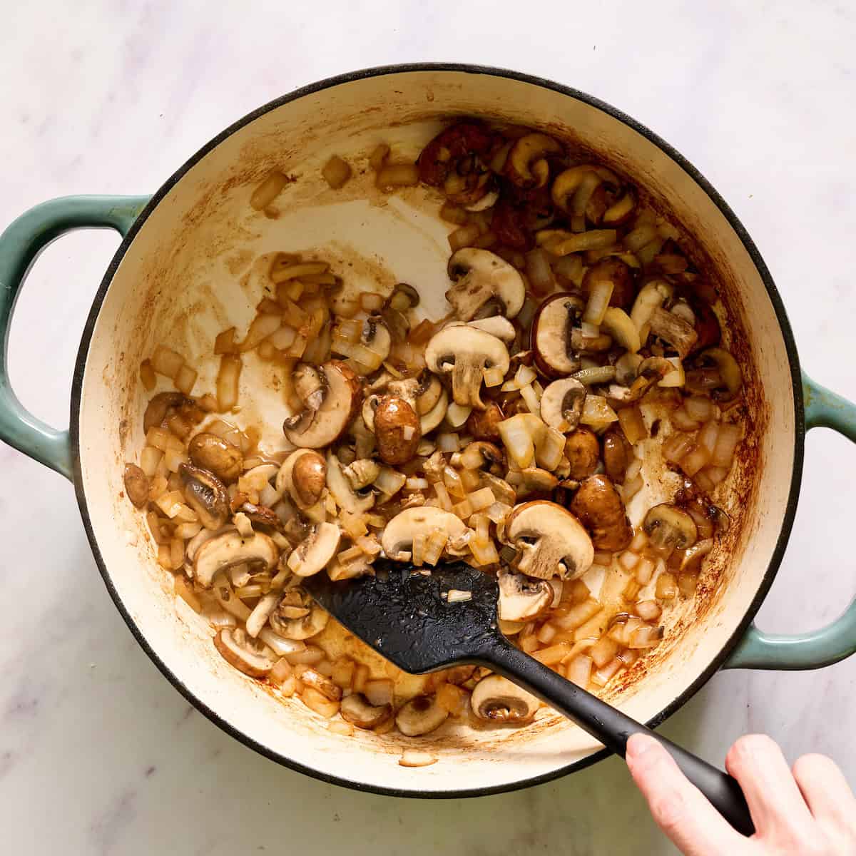 sauteing mushrooms and onions in butter
