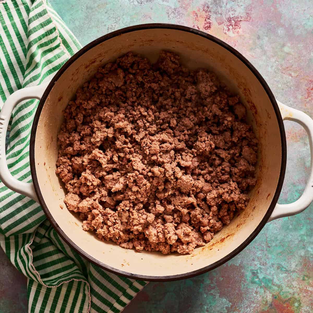 browning sausage and beef in a stock pot