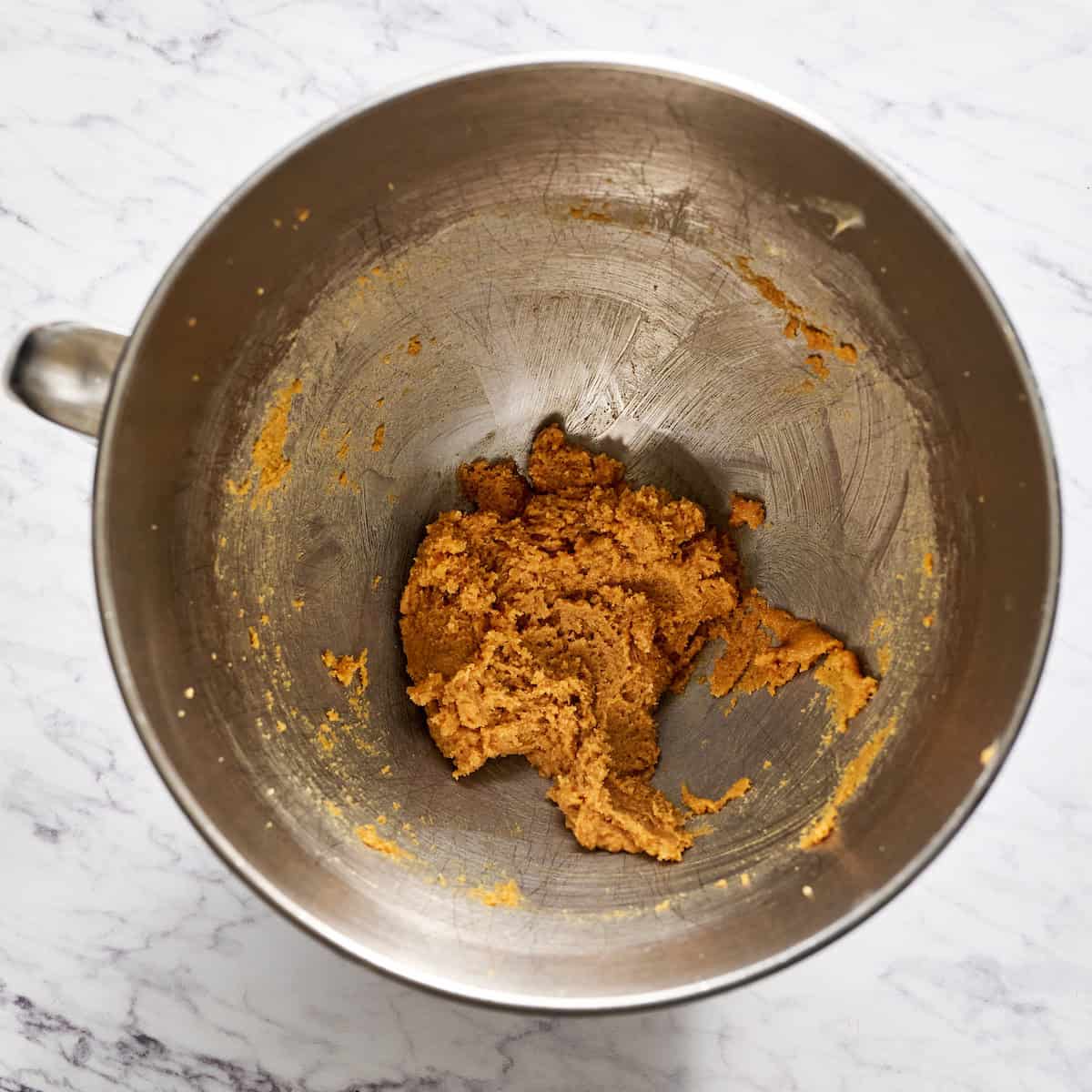 mixing the almond butter, sugar and butter