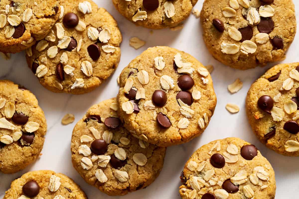 leftover oatmeal cookies scattered with extra oats on top