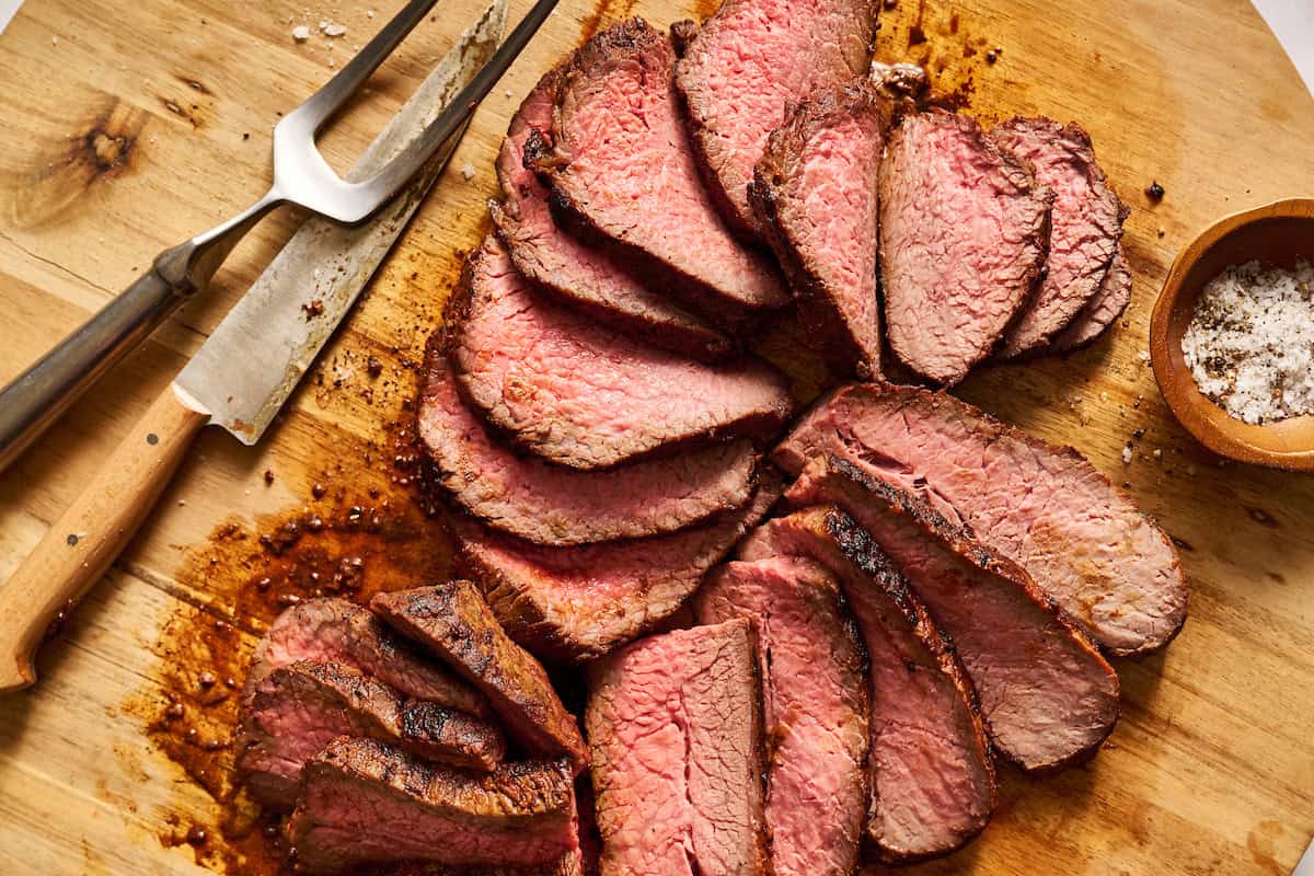sliced tri tip steak on a platter