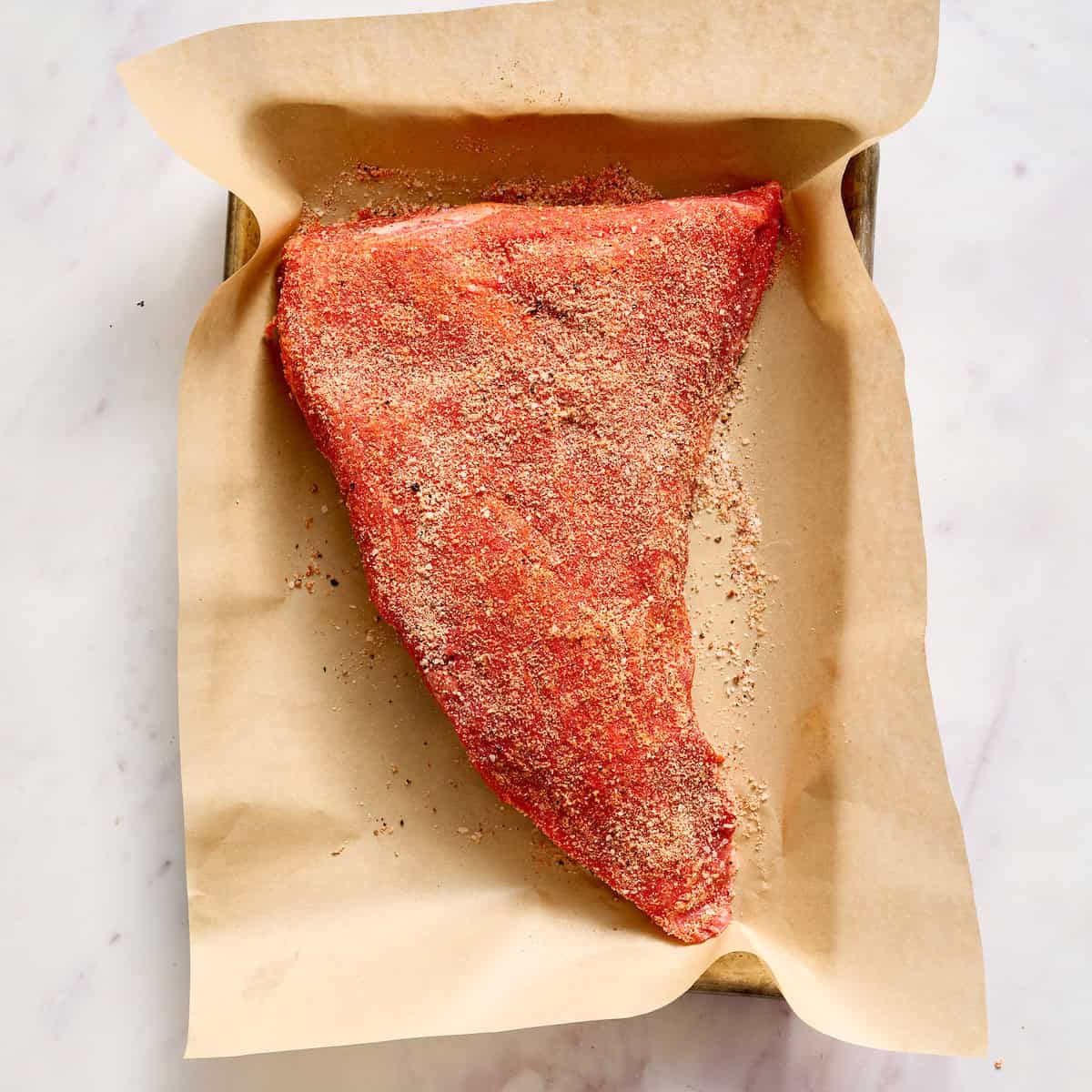 tri tip roast covered in sweet paprika rub