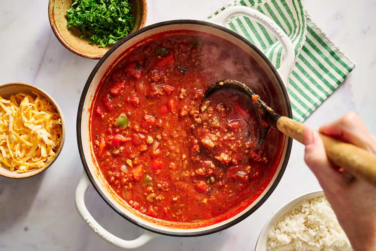 stuffed pepper soup in a pot being ladled